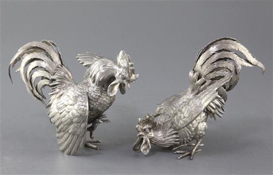 A pair of late 19th/early 20th century German Hanau naturalistically cast 800 standard silver models of fighting cocks, 20 oz.
